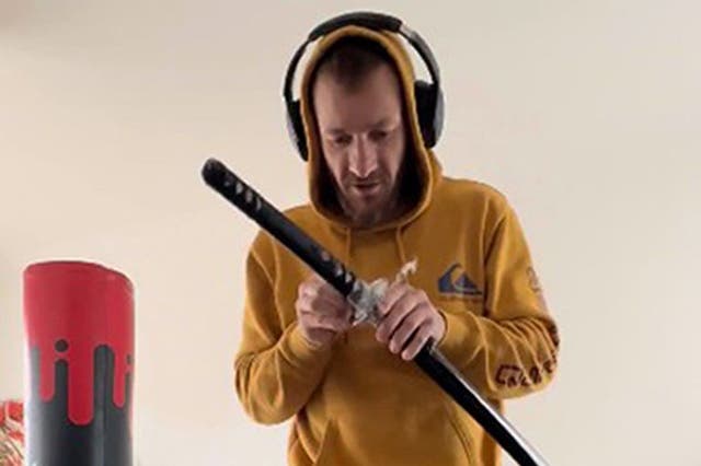 <p>Marcus Arduini Monzo with a samurai sword that was shown to the jury in his trail at the Old Bailey (Metropolitan Police/PA)</p>