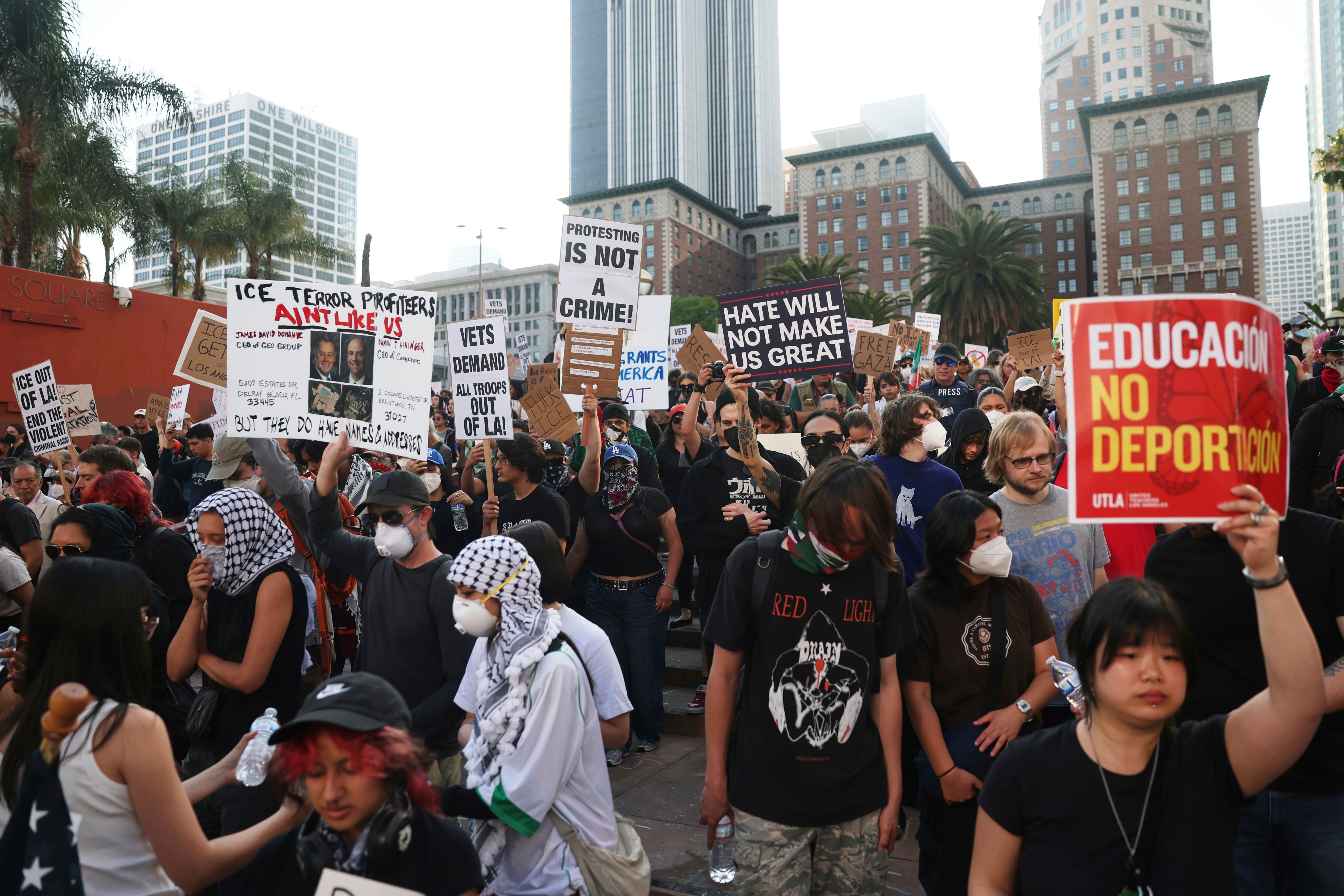 Attendees listen to a speaker during a protest at Pershing Square, Wednesday, June 11, 2025, in Los Angeles.
