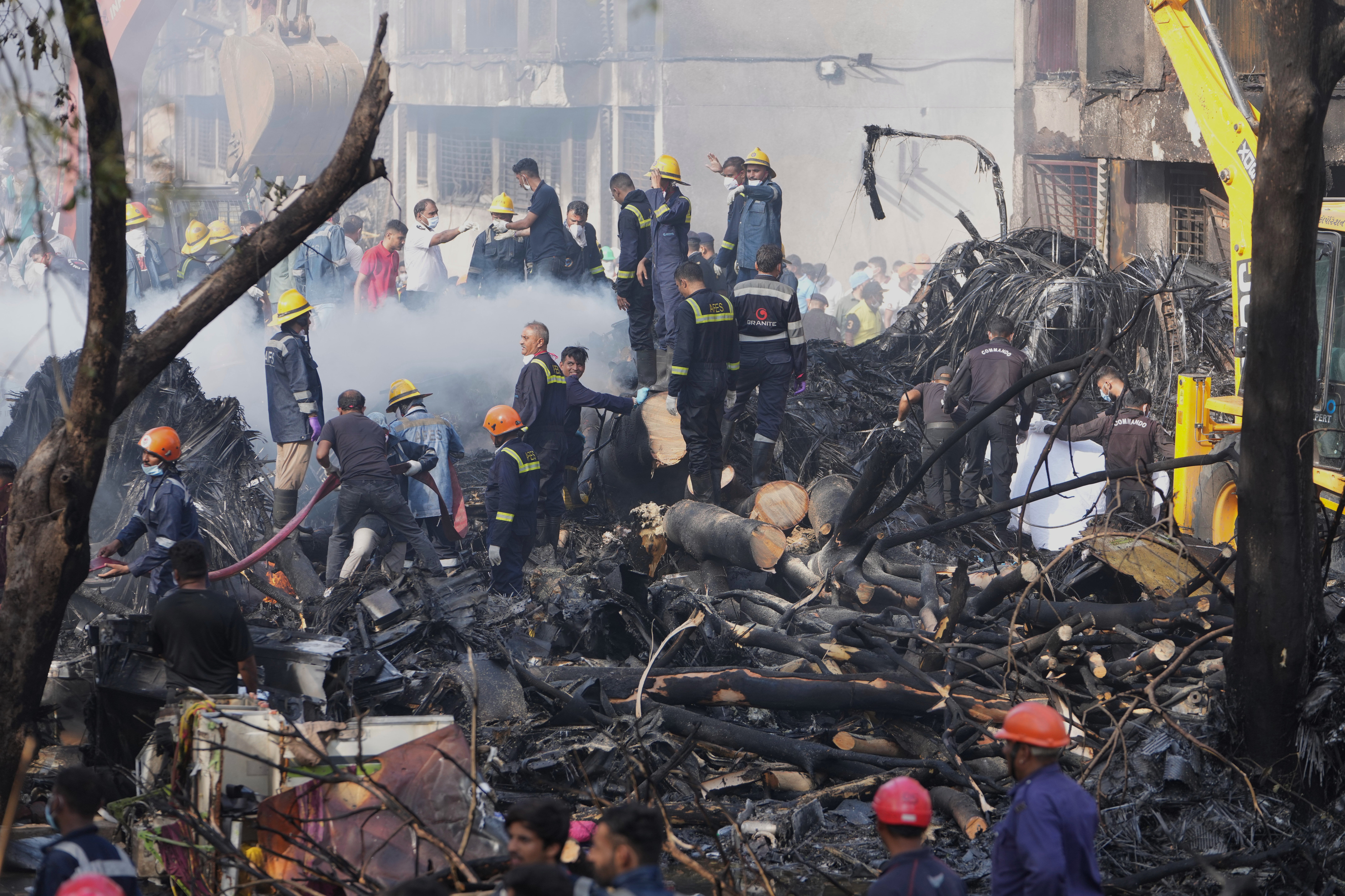 Search and rescue teams respond to the scene of a plane crash in Ahmedabad, India