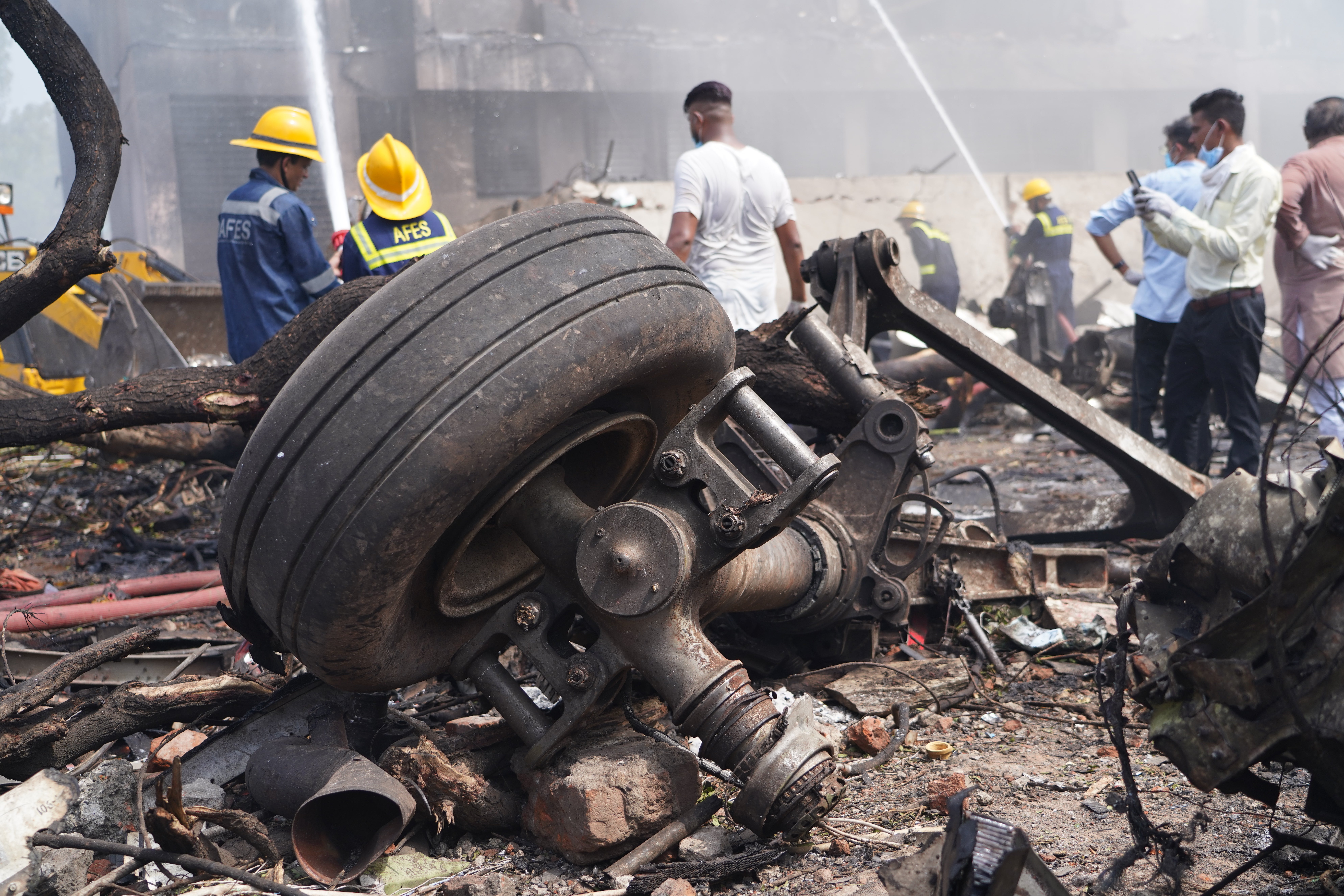 Debris at the site of a plane crash near Sardar Vallabhbhai Patel International Airport in Ahmedabad, Gujarat, western India, 12 June 2025