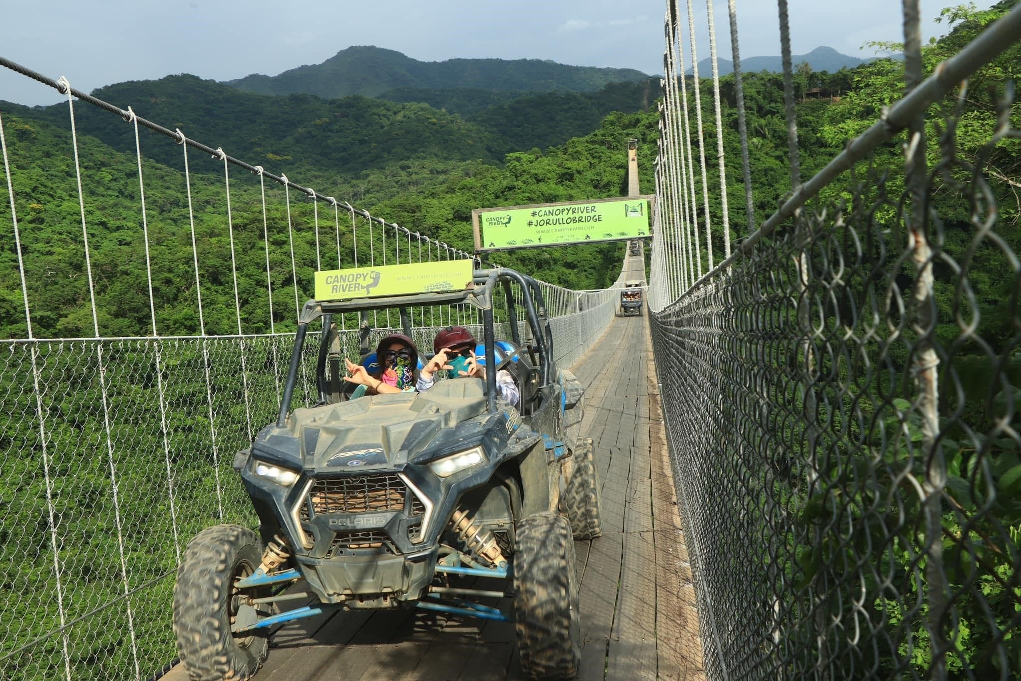 Sam crossing the 'amazing' Jorullo suspension bridge, near Puerto Vallarta, in an all-terrain vehicle