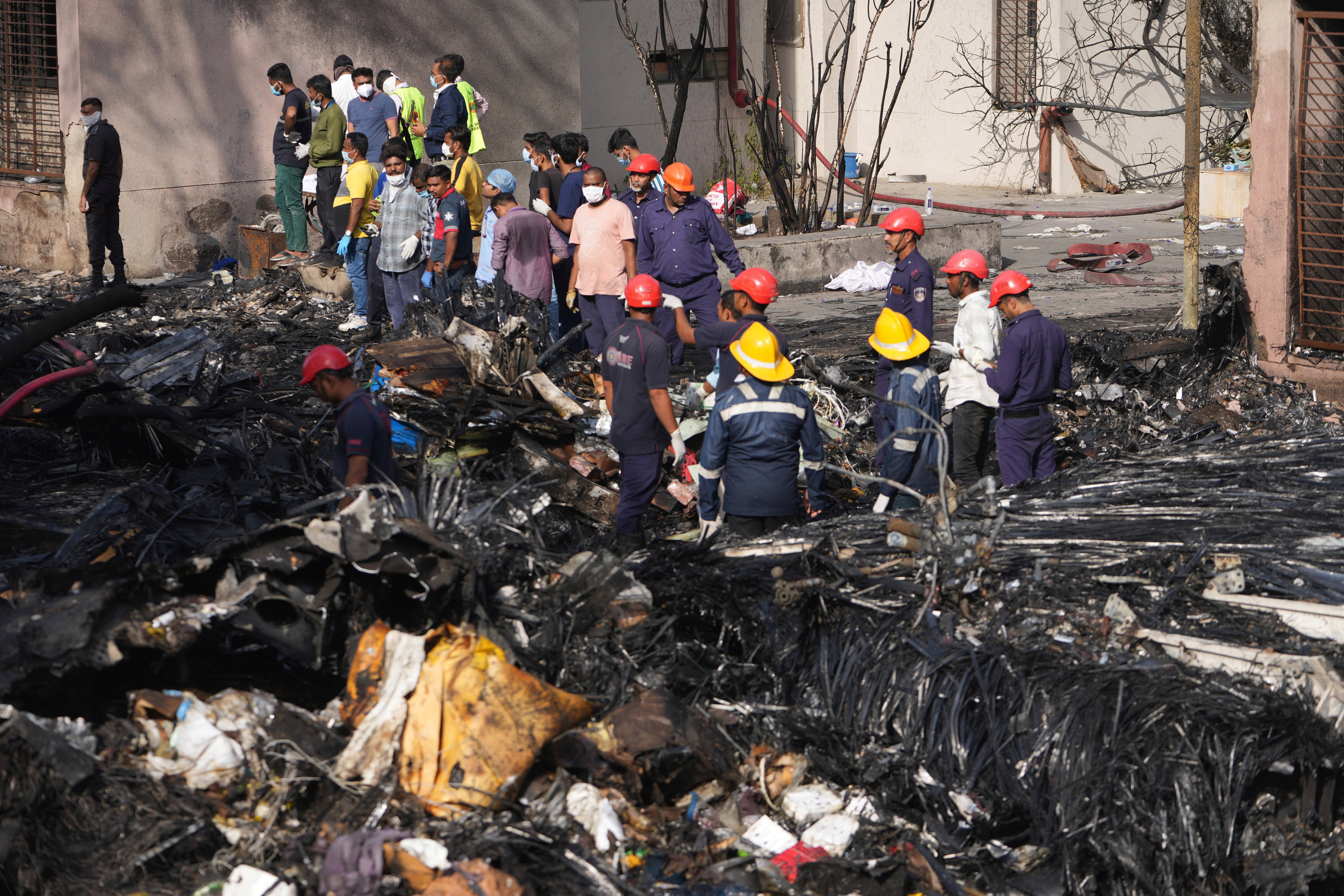 Search and rescue teams respond to the scene of a plane crash in Ahmedabad (Ajit Solanki/AP)