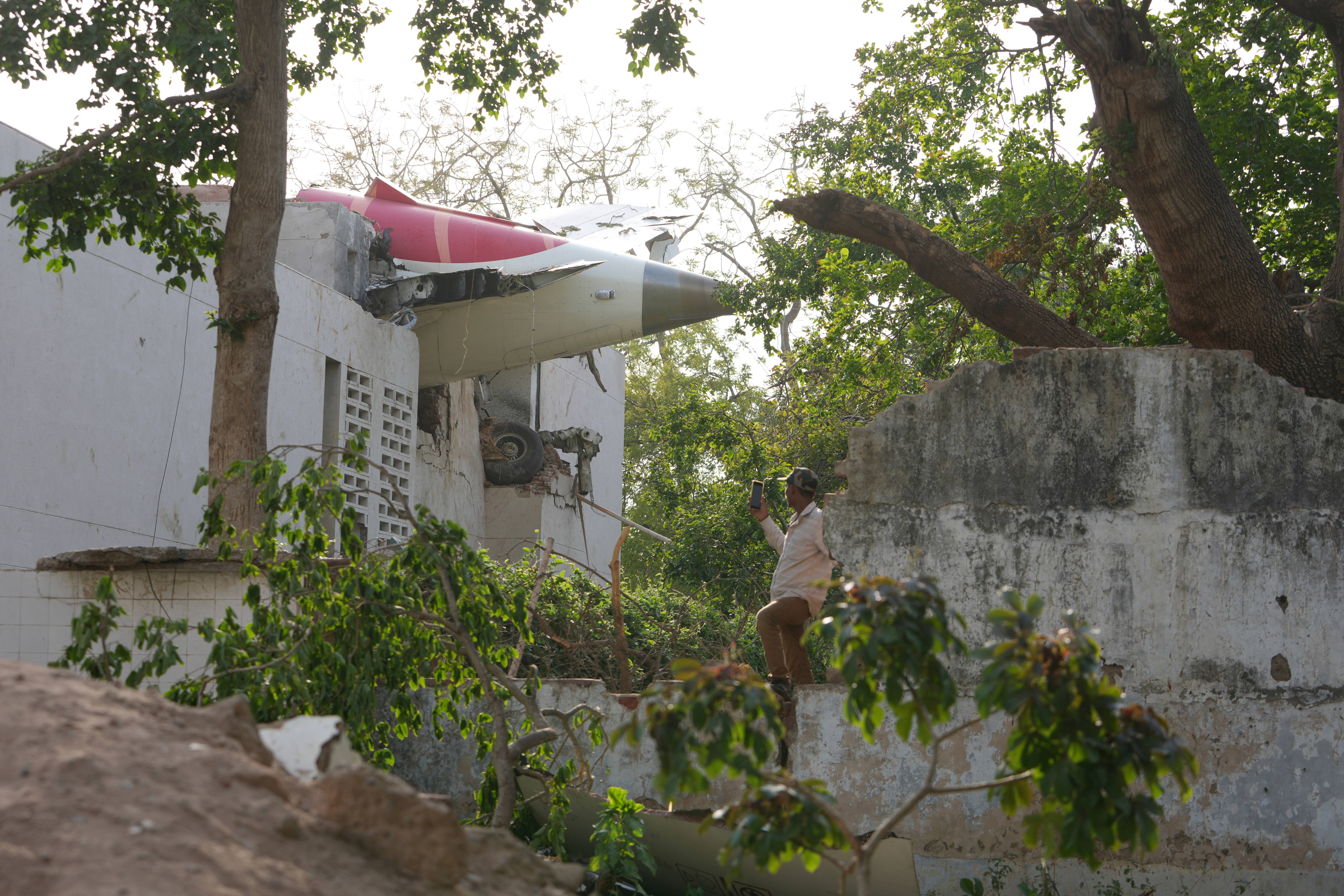 Brands of plane sticks from the building (Ajit Solanki / AP)
