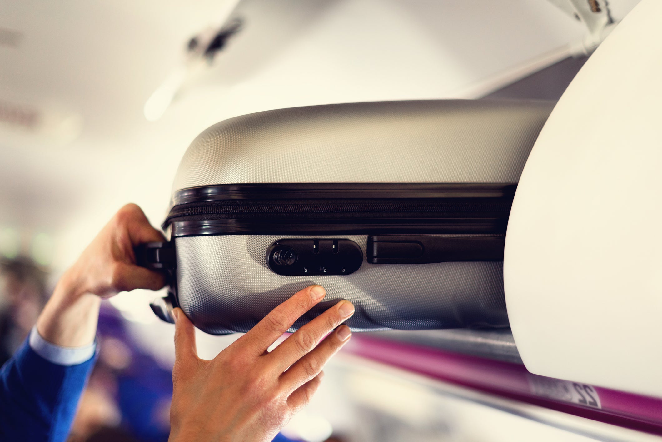 Mr Genter, a popular travel blooger, was told that moving a flight attendant's bag was 'not allowed'
