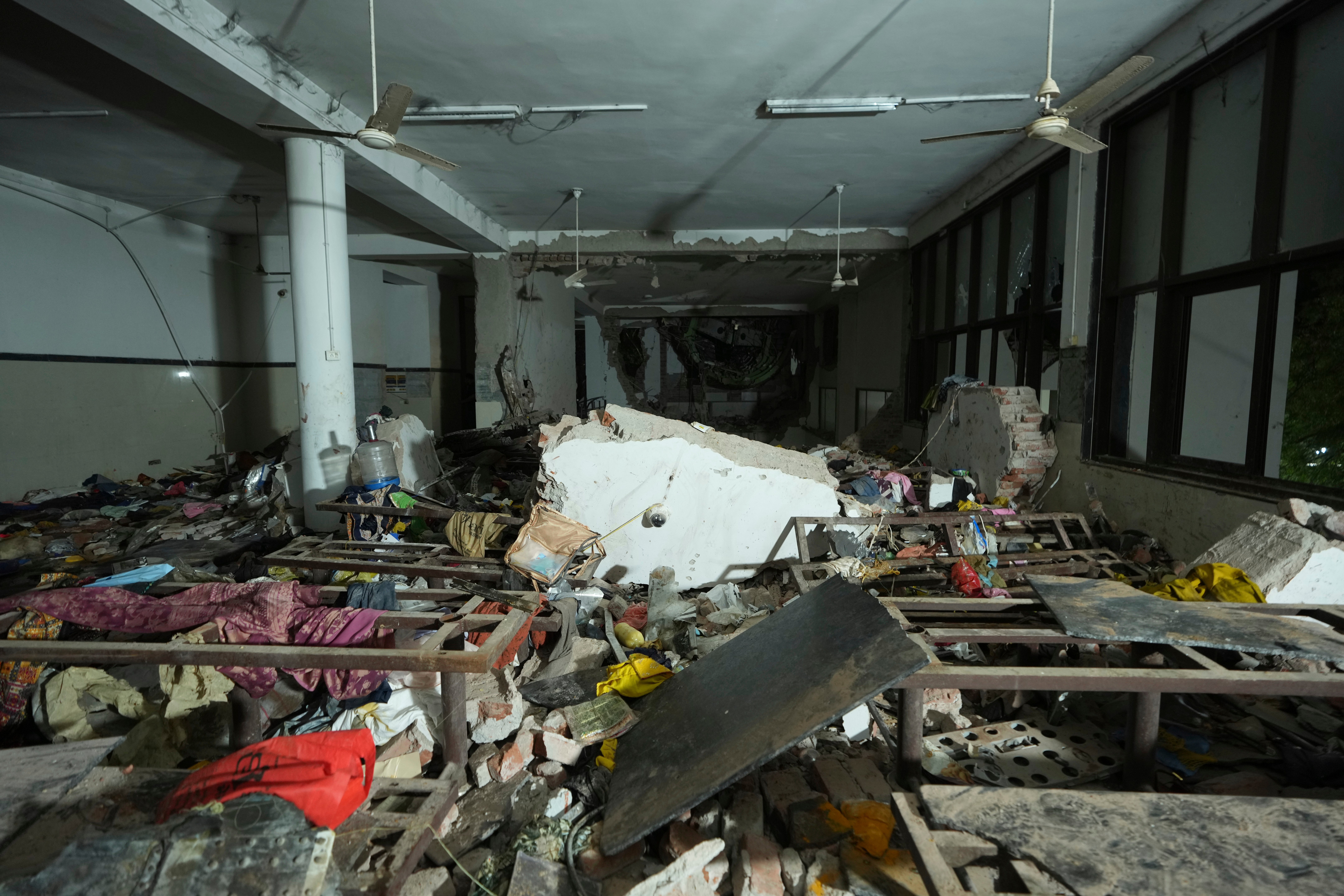 Inside view of a canteen building where the tail of the airplane stuck at the site of an airplane that crashed in India's northwestern city of Ahmedabad in Gujarat state