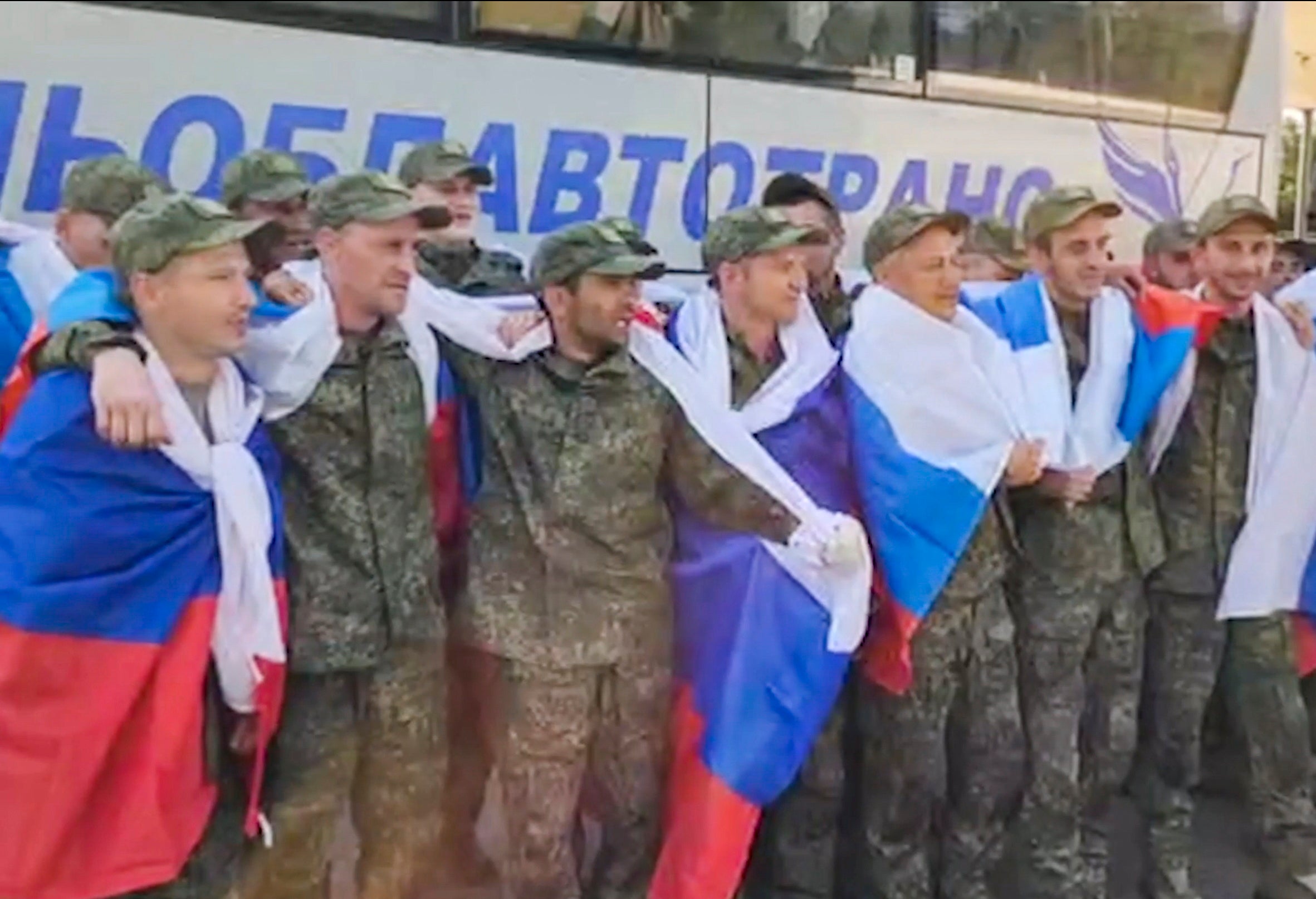 Russian troops taking a bus after being released in a prisoners swap between Russia and Ukraine