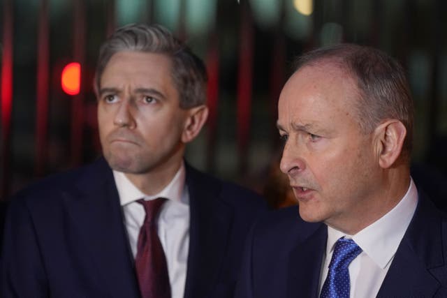 Fine Gael leader Simon Harris TD (left) and Fianna Fail leader Micheal Martin called for diplomacy in the Middle East (PA)