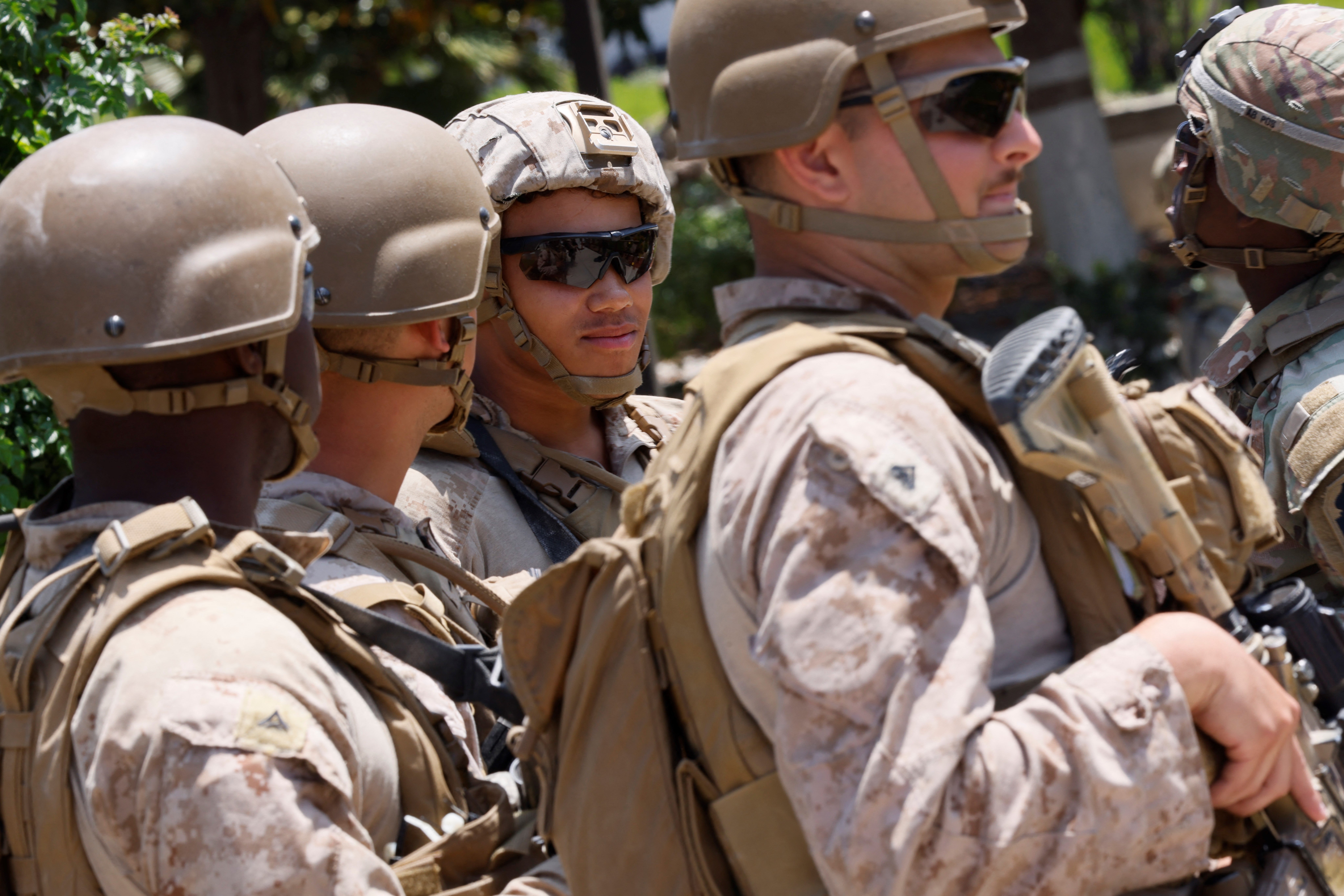 US Marines stand guard at one of the entrances to the Wilshire Federal Building in Los Angeles on Friday