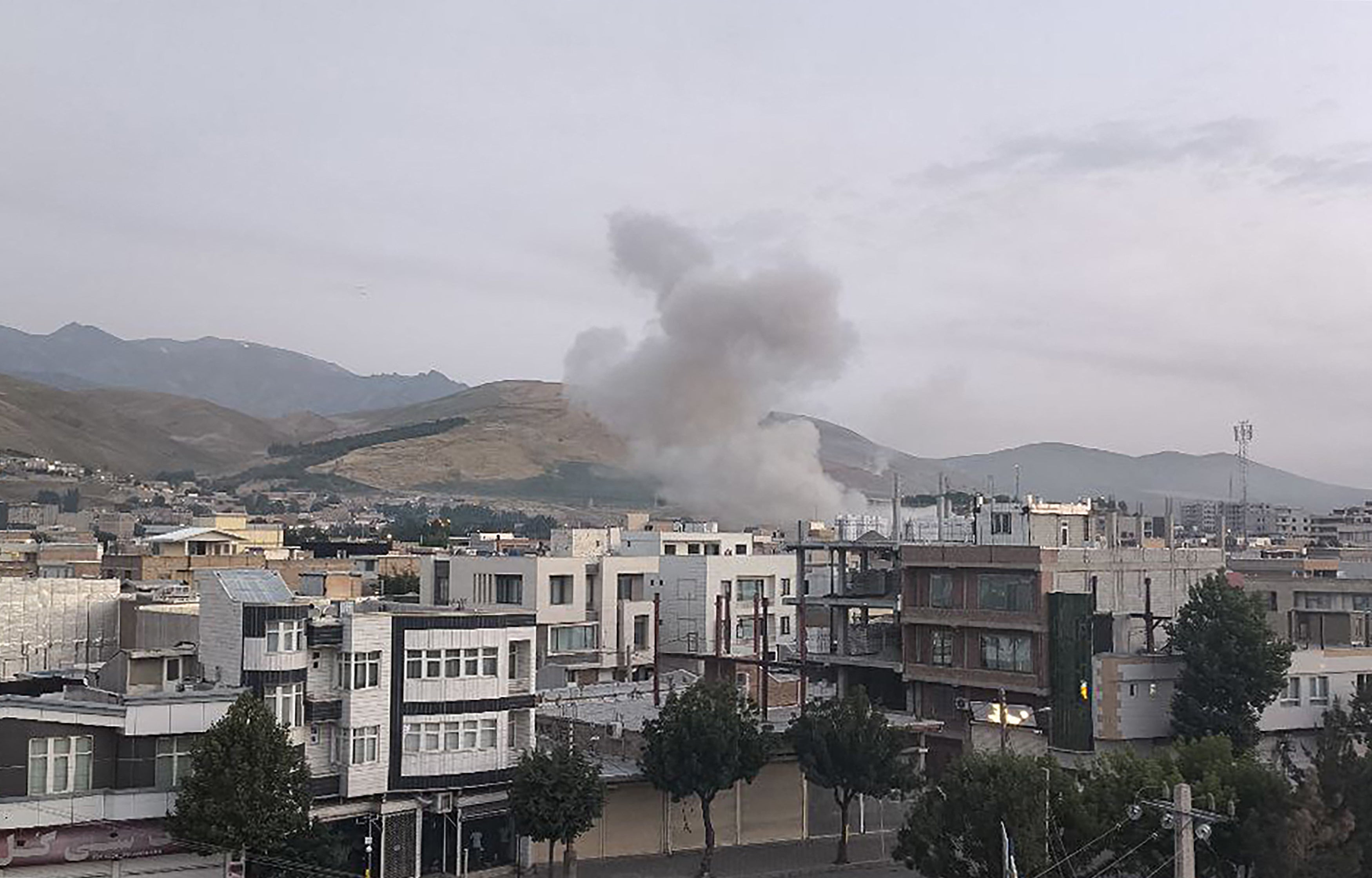 Smoke billows from a site targeted by an Israeli strike in the Iranian capital Tehran early in the morning