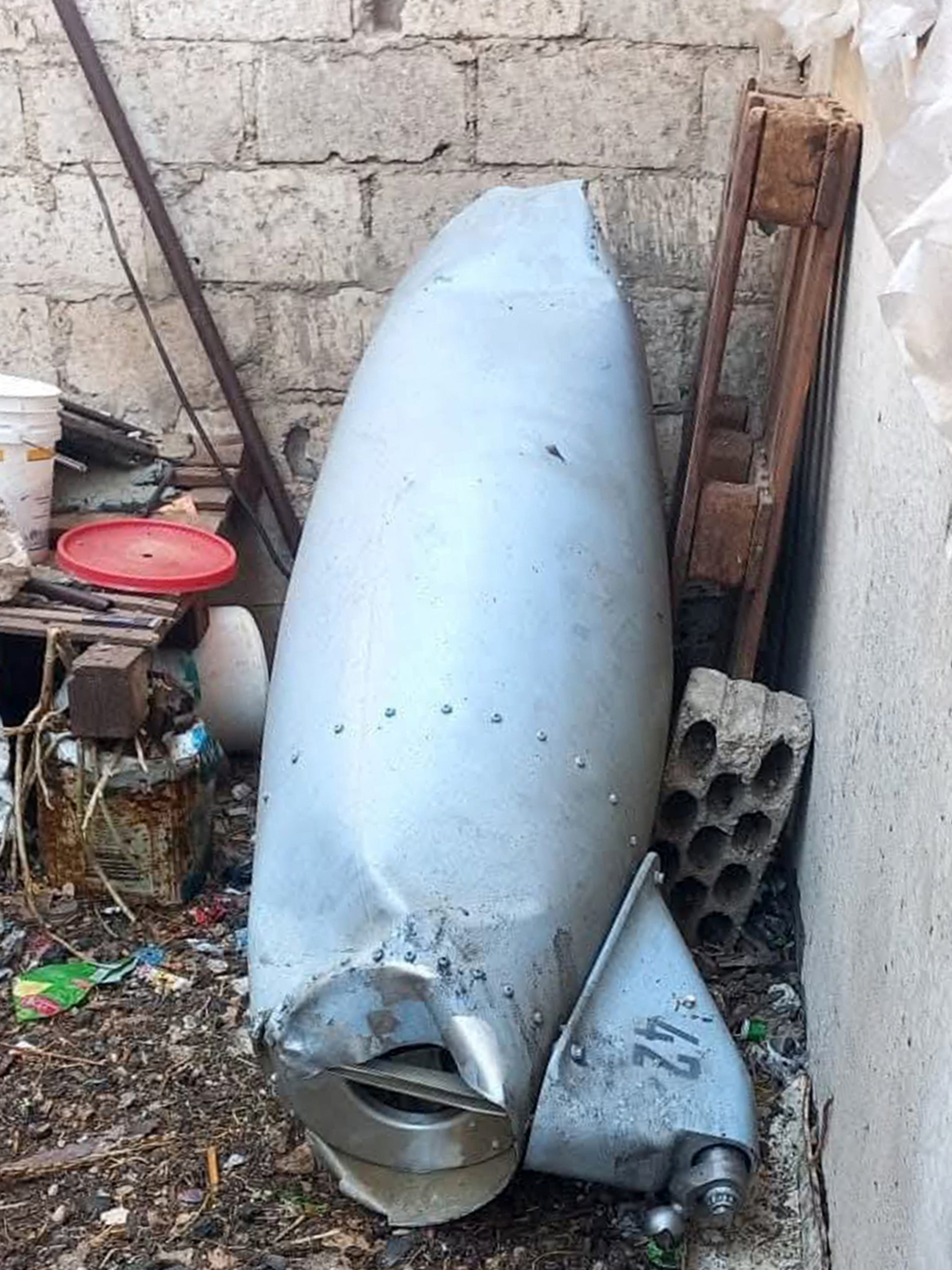 This handout picture released by the official Syrian Arab News Agency (SANA) shows the remains of an Iranian projectile that was headed for Israel after it fell in Syria's southwestern Daraa province on June 13, 2025