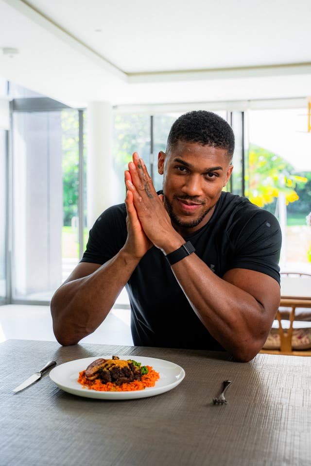 <p>Anthony Joshua with food</p>