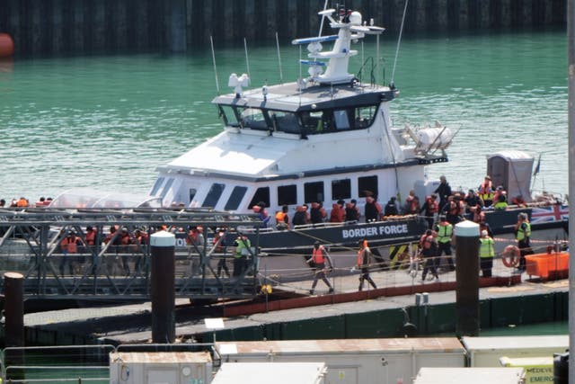 A group of people thought to be migrants are brought in to Dover (Gareth Fuller/PA)