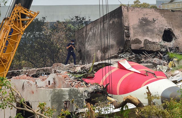 <p>Investigators at the scene of the Air India crash in Ahmedabad, India, on 14 June 2025</p>