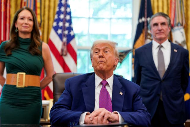 <p>Donald Trump with Brooke Rollins, his USDA secretary, standing to the left and Doug Burgum, Interior secretary, to the right</p>