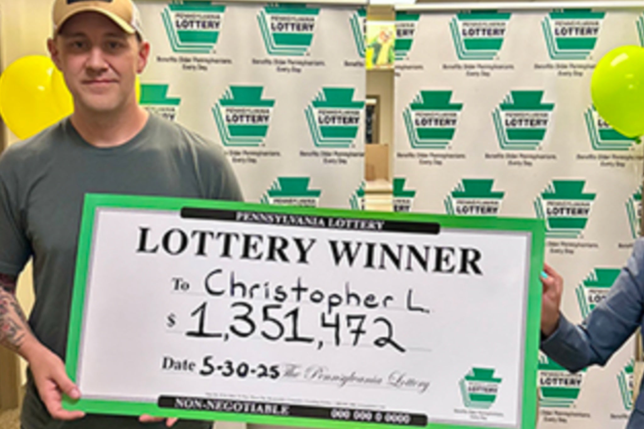 Army vet Christopher Lehman collected his $1.3 million prize money with a commemorative check.