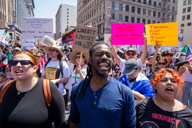 <p>Demonstrators take part in a “No Kings” protest against the Trump administration in downtown Los Angeles, California, on June 14 2025</p>