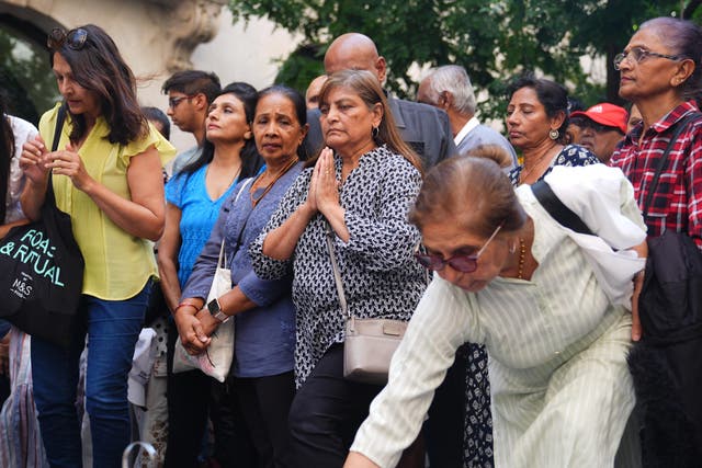 People attend a candlelight vigil outside the High Commission of India (James Manning/PA)