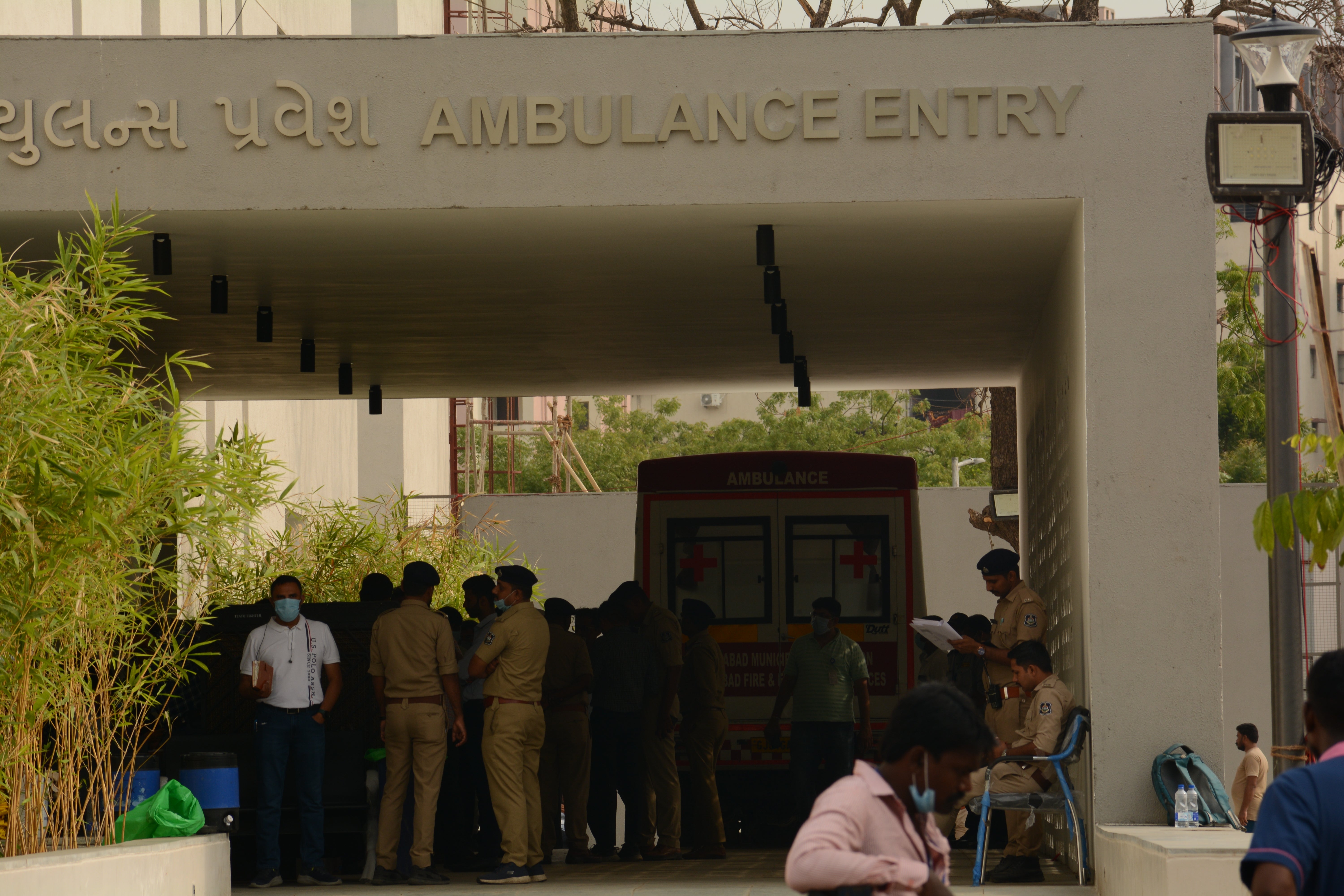 Police and ambulance outside of Civil Hospital in Ahmedabad, where bodies of Air India crash victims are being identified and handed over