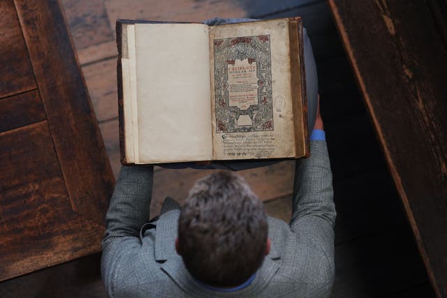 Dr Tony Trowles, head of the Abbey Collection, with a rare first edition of the Welsh Bible (Yui Mok/PA)