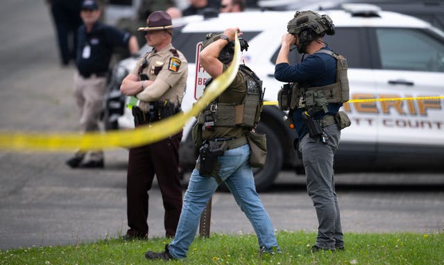 <p>Law enforcement search a neighborhood in Green Isle, Minnesota on June 15 as a manhunt continues for Vance Luther Boelter, who is accused of killing state Rep. Melissa Hortman and her husband, Mark Hortman, and critically injuring state Sen. John Hoffman, also a Democrat, and his wife, Yvette</p>