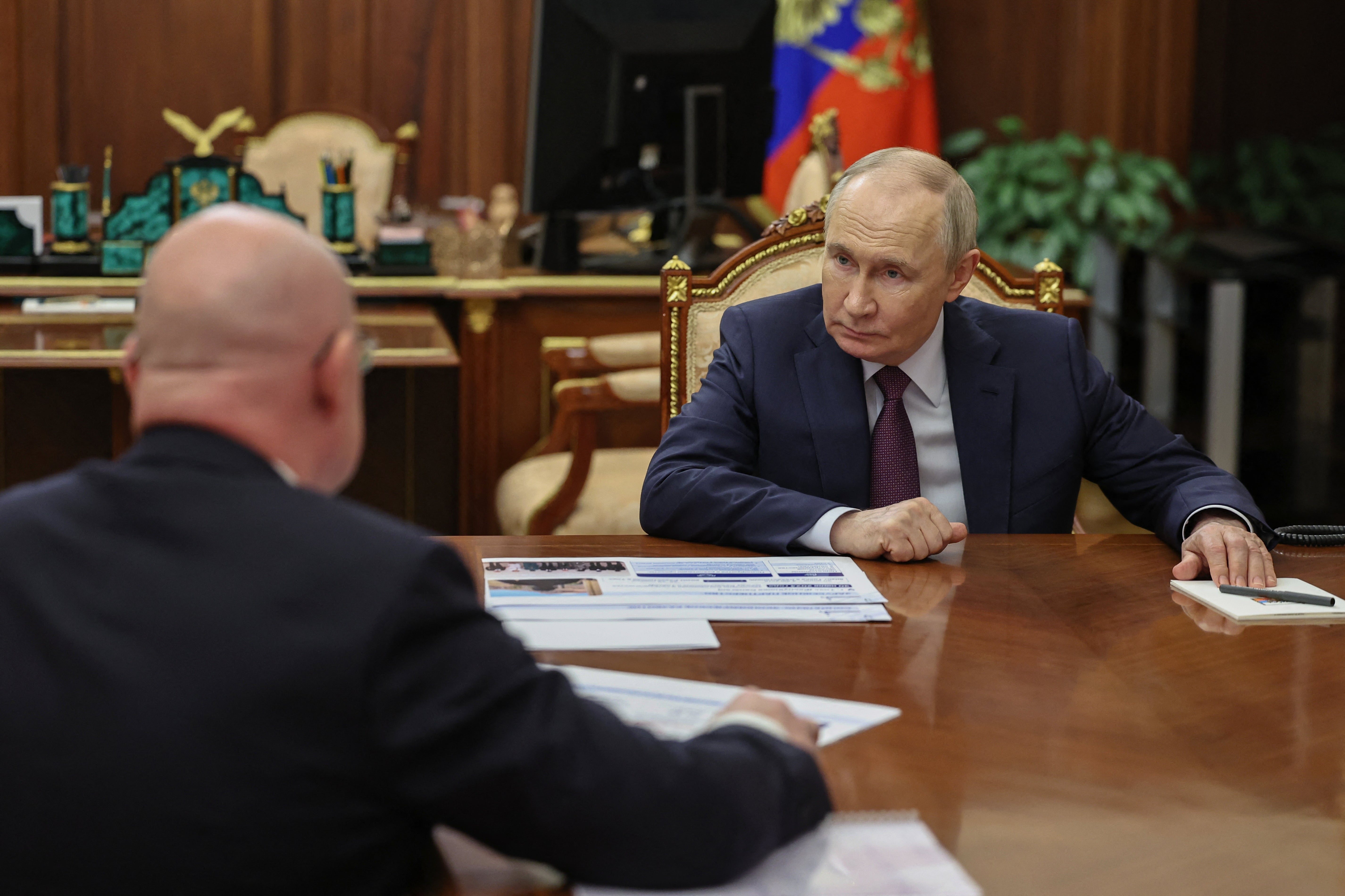 Russia's president Vladimir Putin meets with the governor of Sevastopol Mikhail Razvozhaev in Moscow