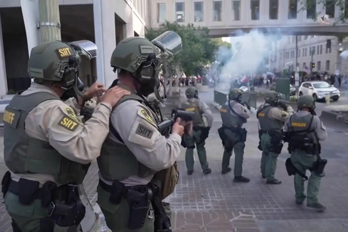 Police use tear gas on anti-Trump protesters in LA