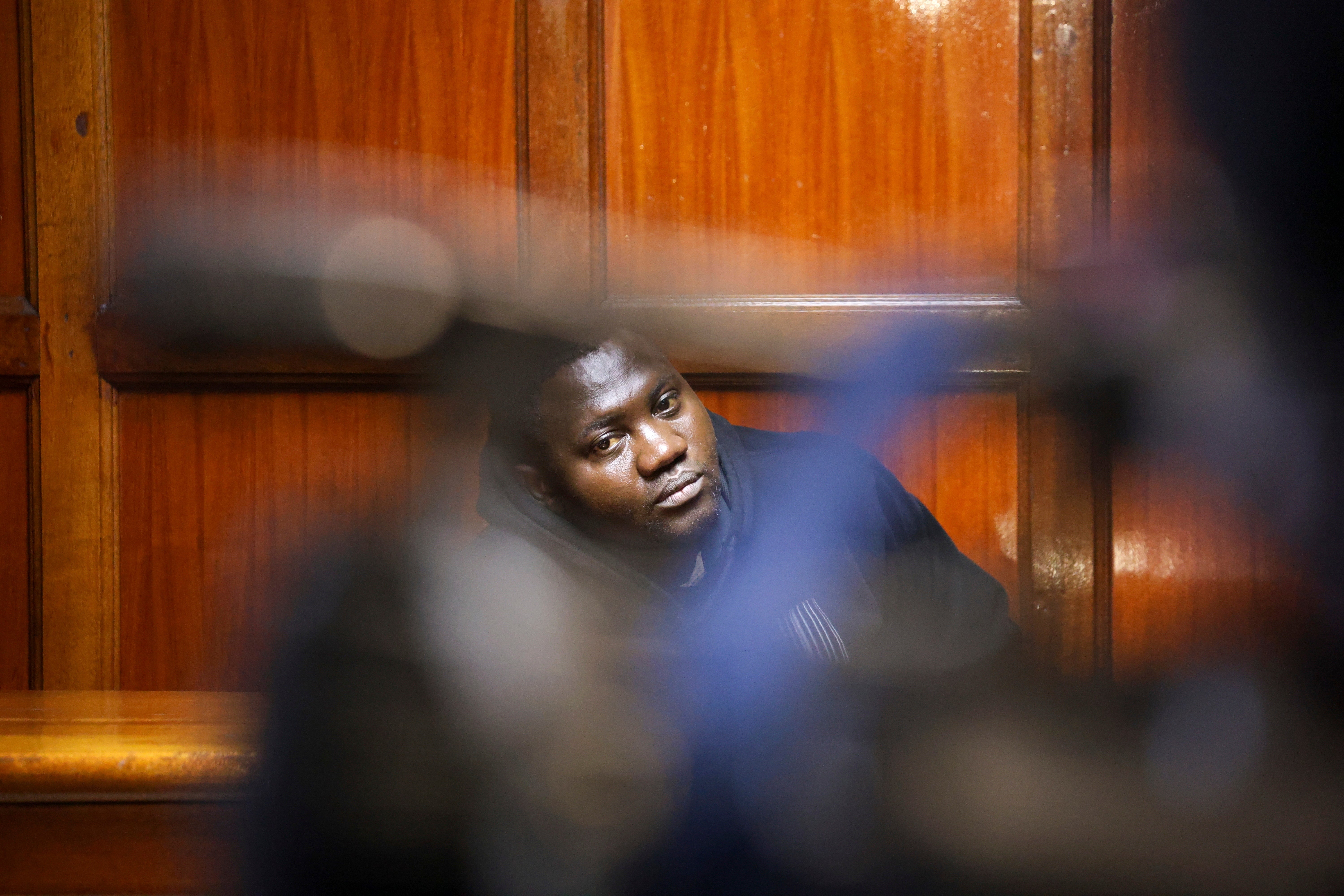 James Mukhwana, a Kenyan police officer, appears in court in Nairobi, Kenya, Friday, June 13, 2025, after being arrested in connection with the death of blogger Albert Ojwang while in police custody. (AP Photo/Andrew Kasuku)