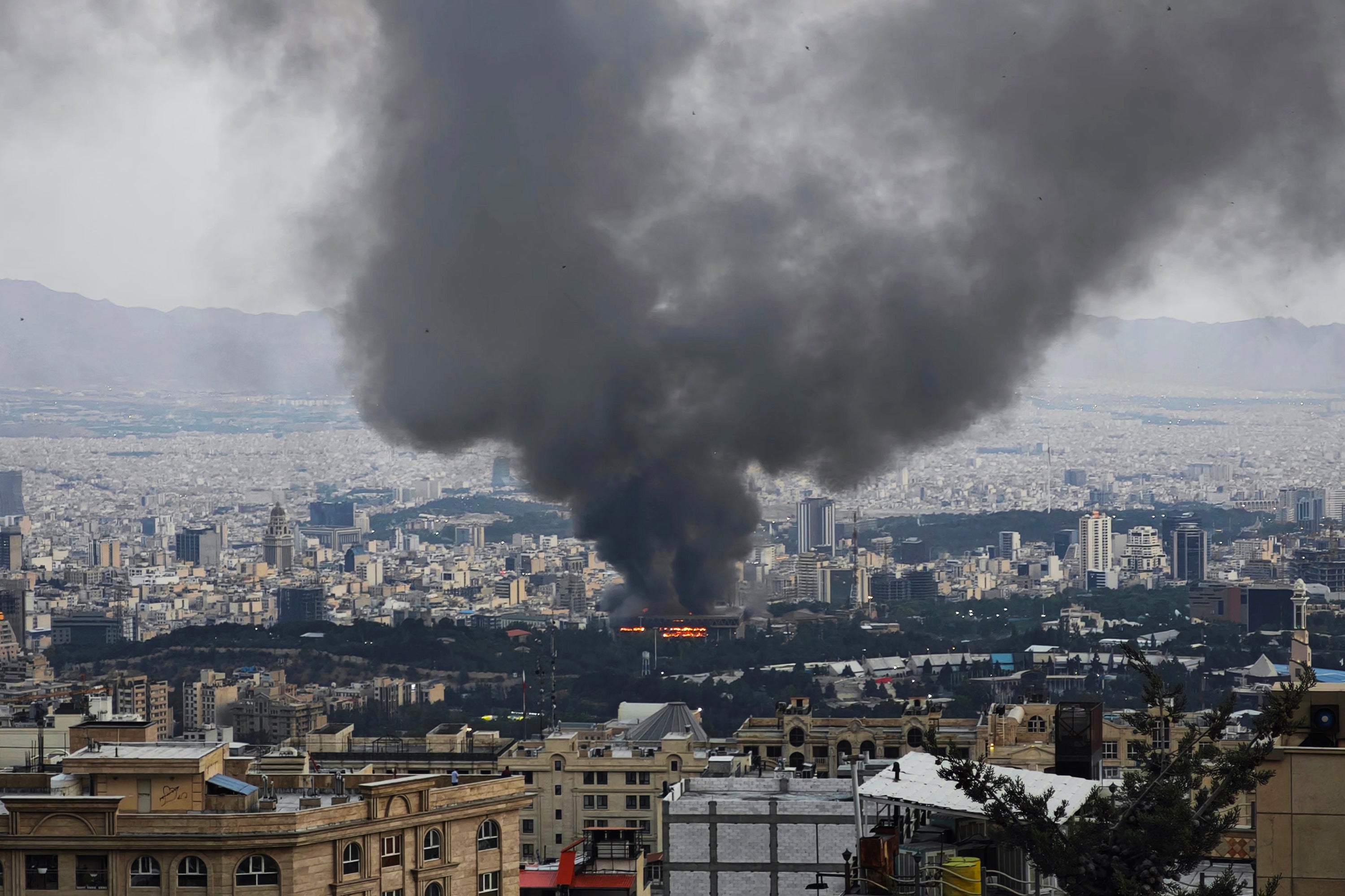 Smoke rises after a reported Israeli strike on a building in Iran