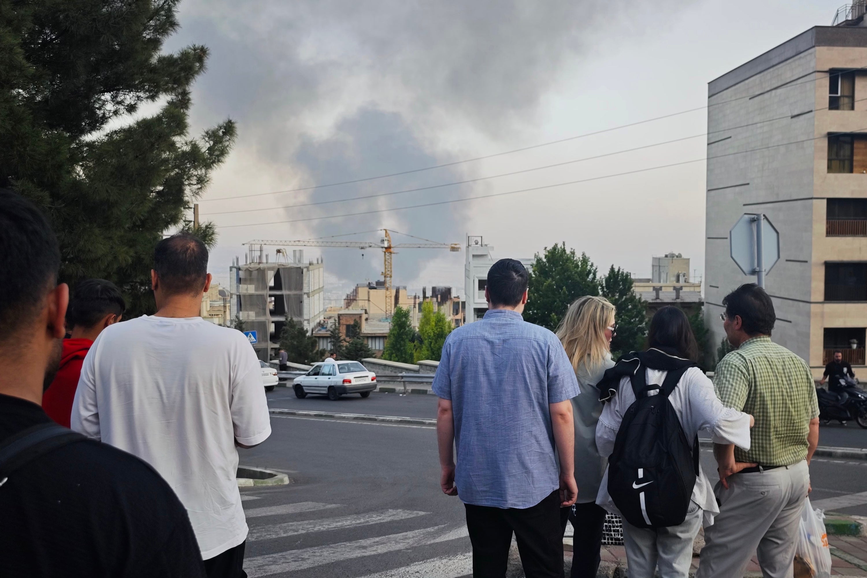 Smoke rises after a reported Israeli strike on a building used by Islamic Republic of Iran News Network, part of Iran's state TV broadcaster