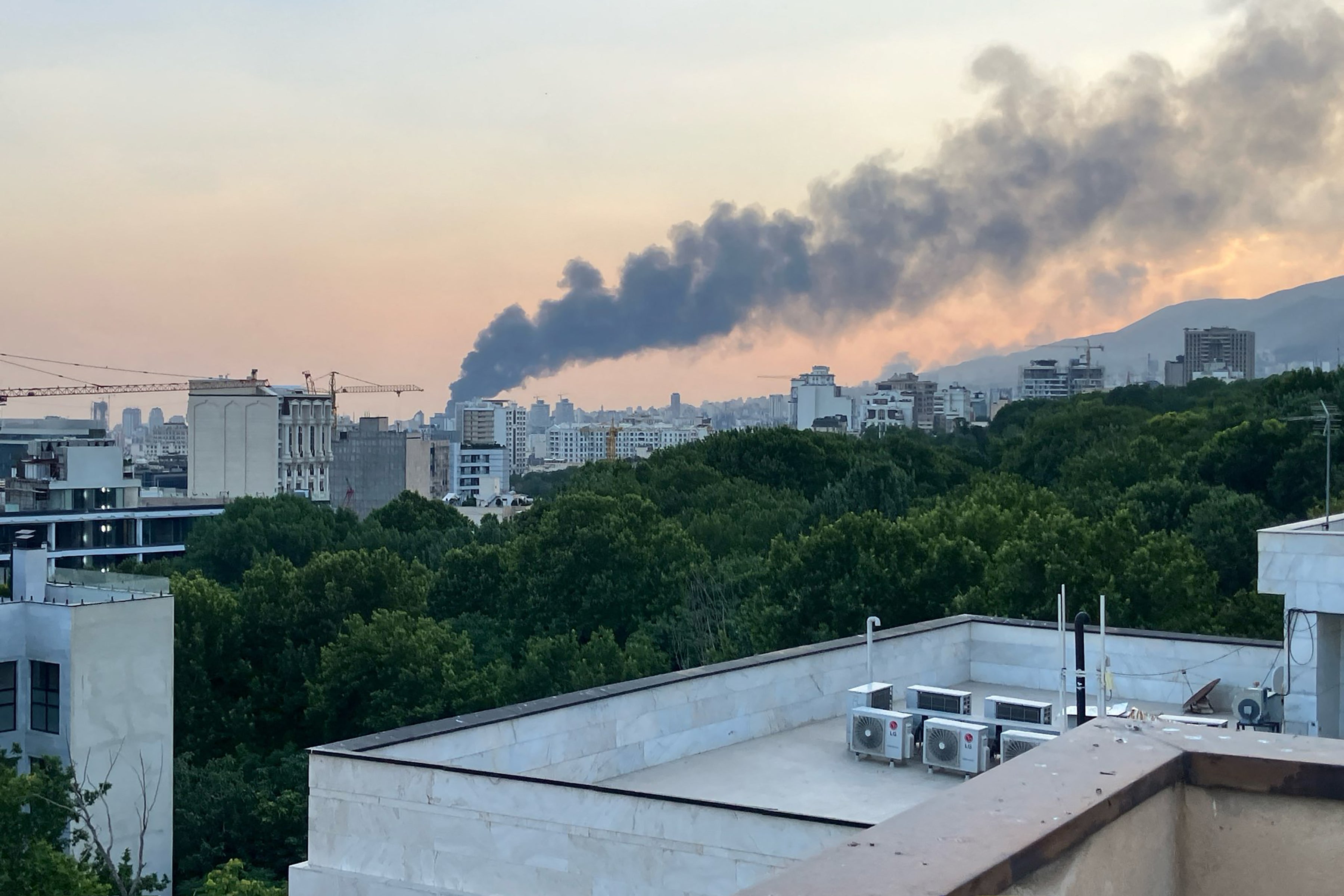 Smoke billows from an explosion at the Islamic Republic of Iran Broadcasting (IRIB) building in Tehran