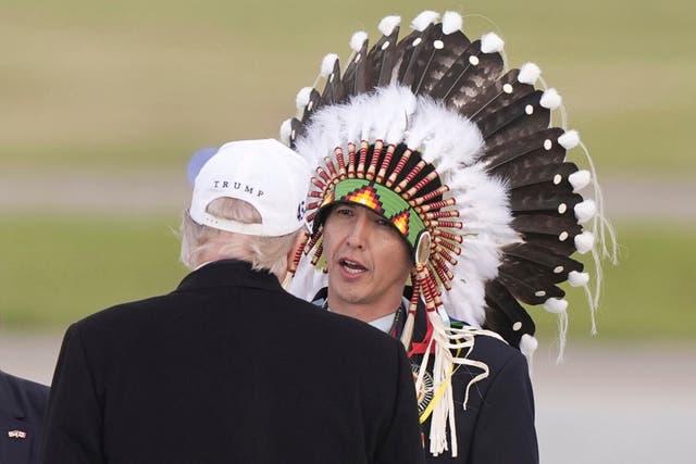 <p>President Donald Trump is greeted by Steven Crowchild of the Tsuut'ina First Nation, as he arrives at Calgary International Airport, Sunday, June 15, 2025, in Calgary, Canada, ahead of the G7 Summit. (AP Photo/Gerald Herbert)</p>