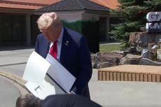 Donald Trump accidentally drops signed US-UK trade deal document