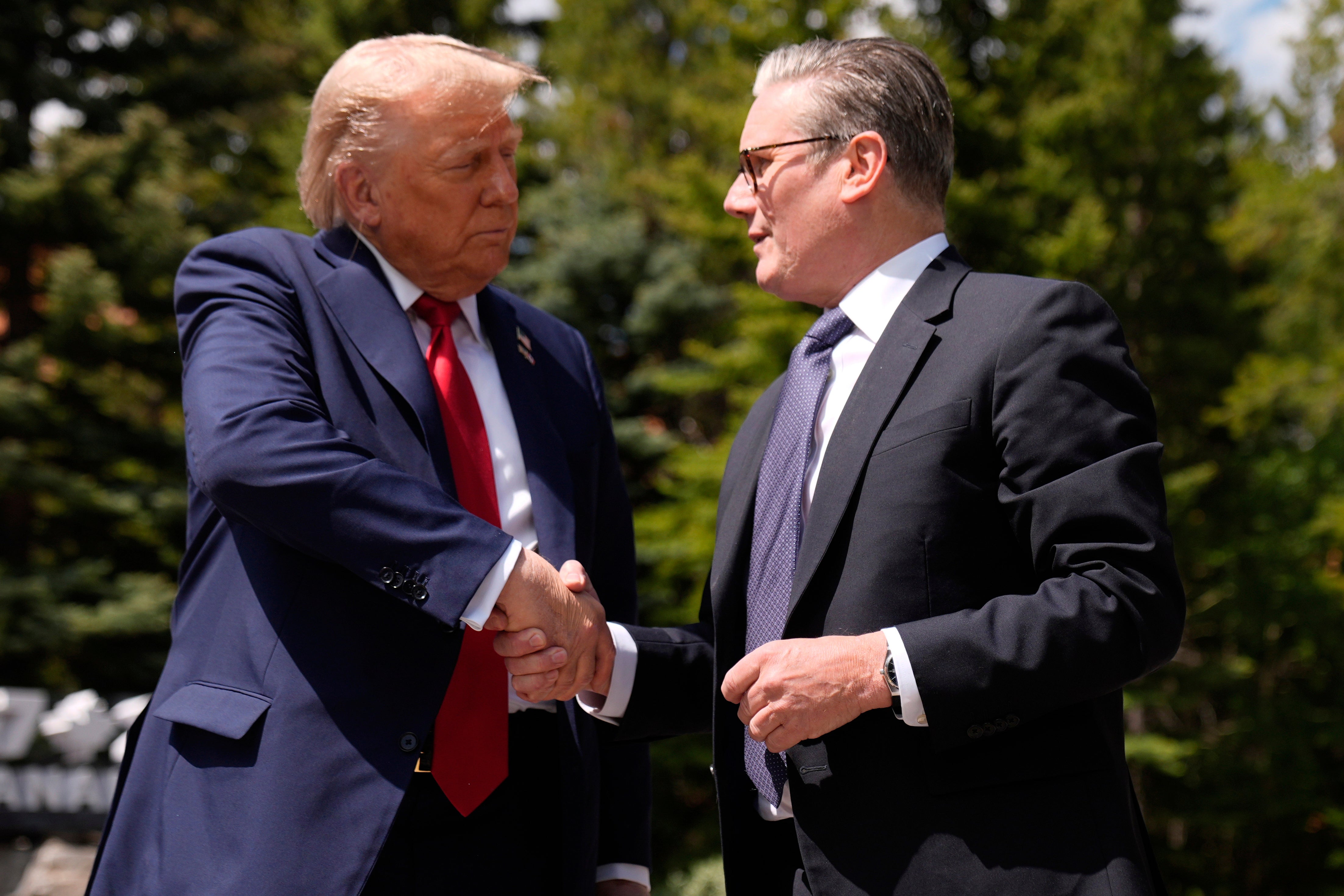 President Donald Trump (shaking hands with British Prime Minister Keir Starmer Monday) skips the rest of this year's seven summits and returns to Washington early after saying a difficult warning to the inhabitants of Iran.