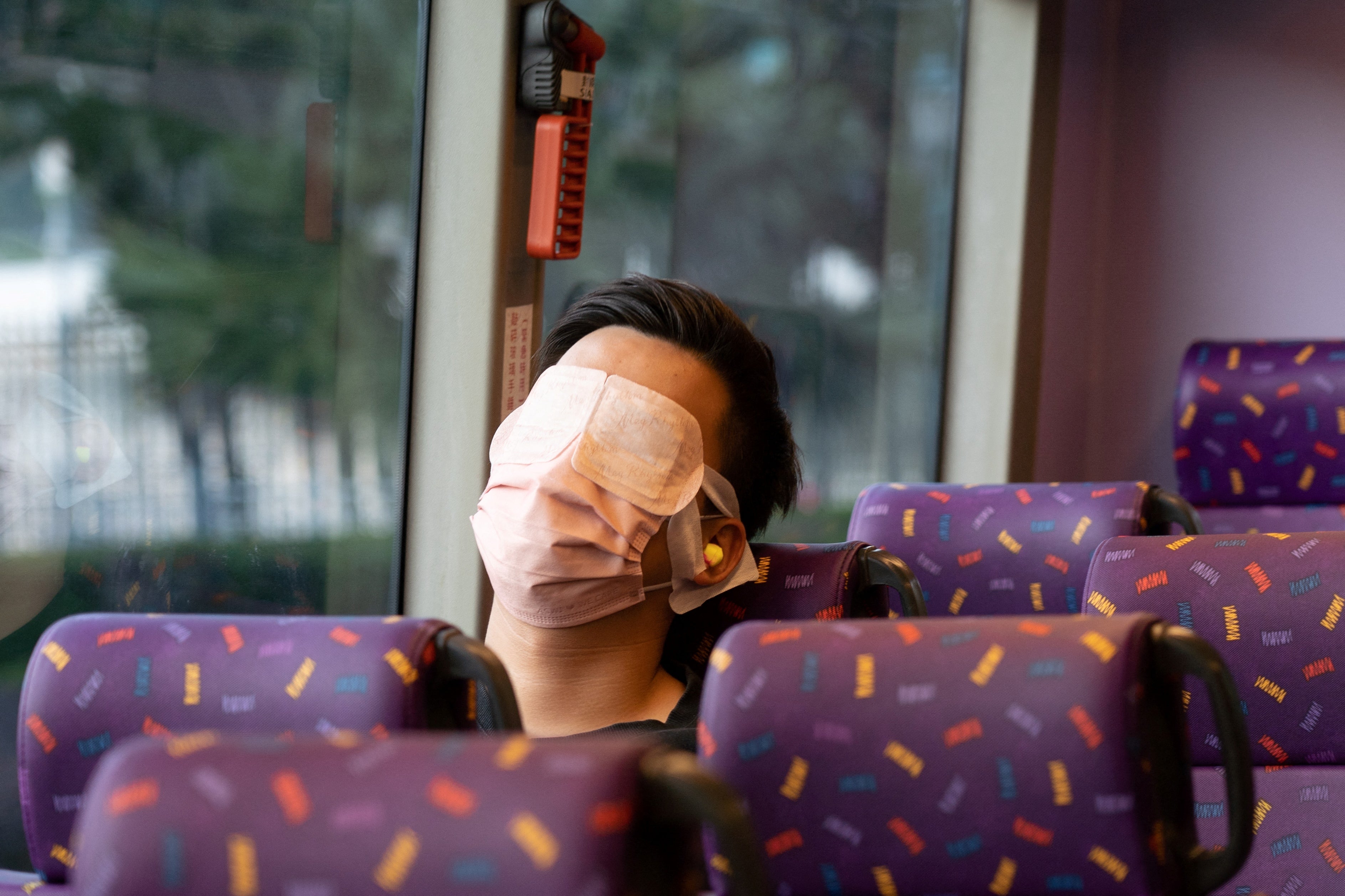 Passenger sleeping on a bus