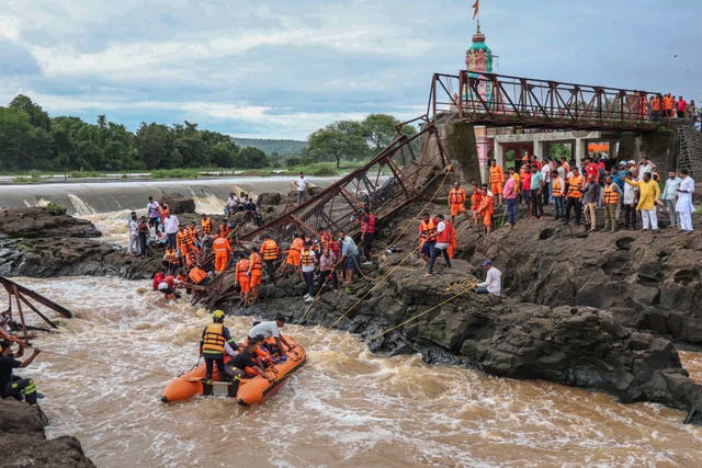 <p>Rescuers work at the site of a bridge collapse over the Indrayani River near Pune, Maharashtra</p>