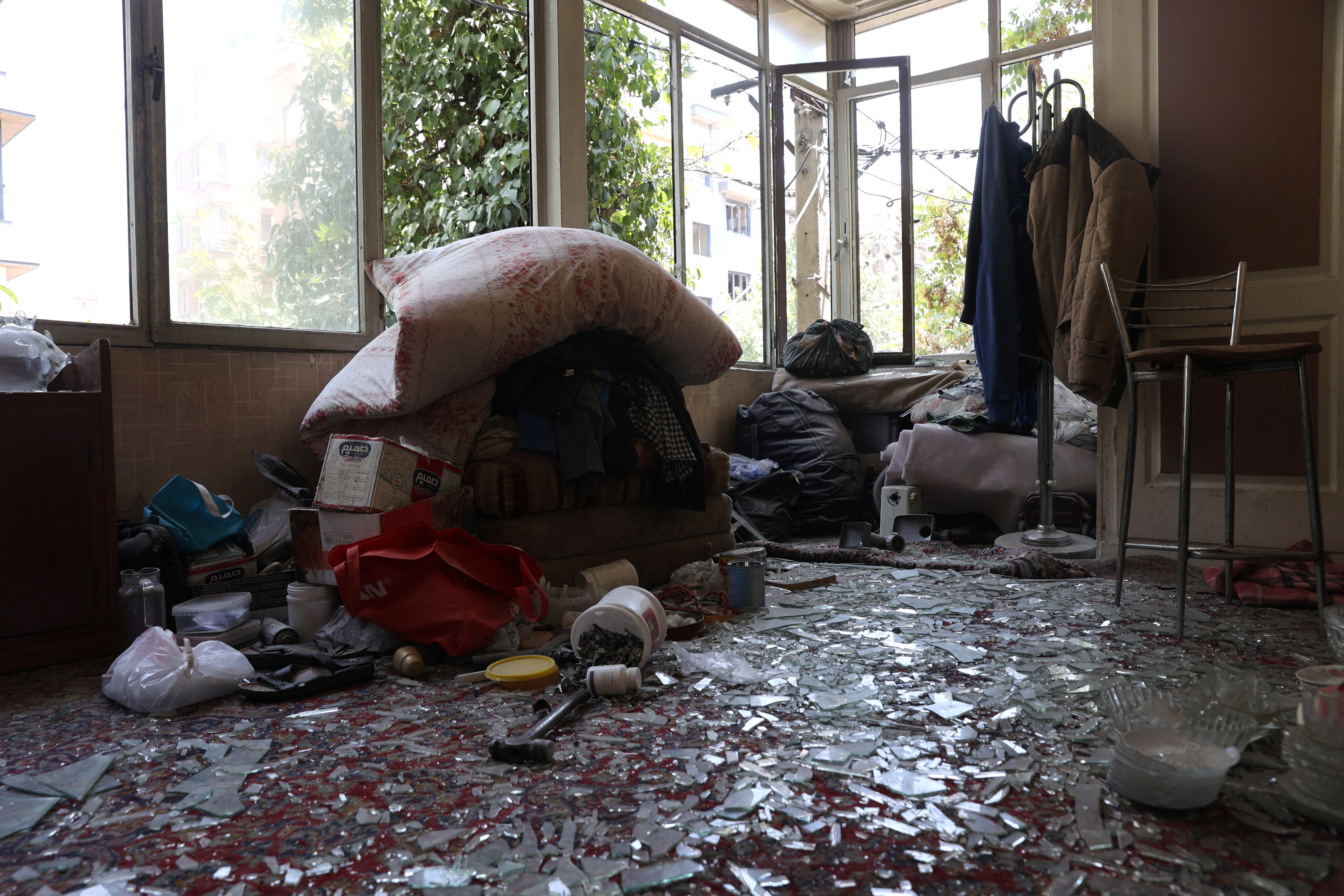 A building stands damaged after an Israeli strike in Tehran