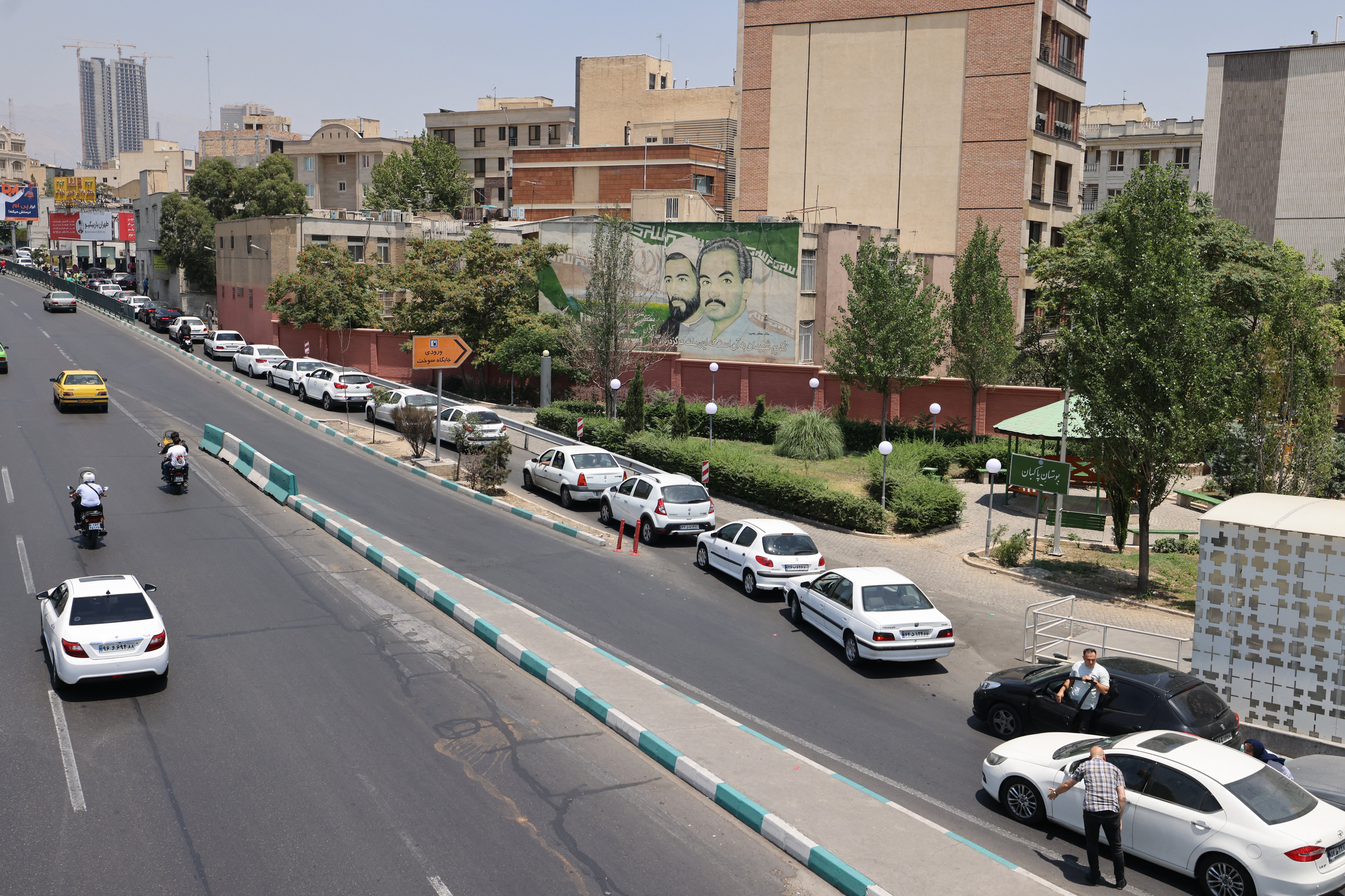 Motorists queue at a petrol station in Tehran on Saturday