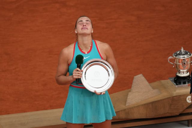 Aryna Sabalenka becomes emotional after receiving her runner-up trophy (Christophe Ena/AP)