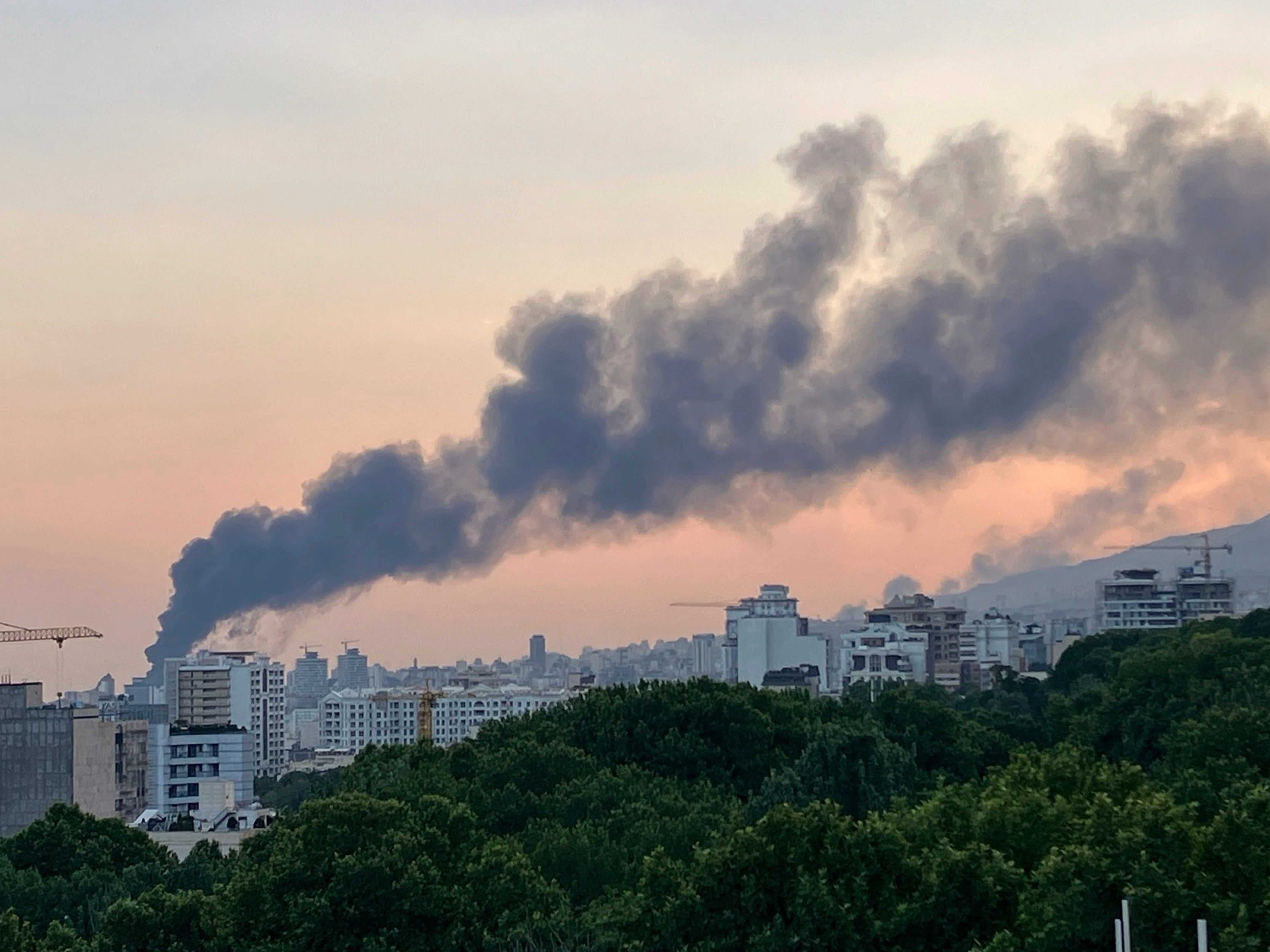 Smoke rises from the building that houses Iran's state-run television after an Israeli strike in Tehran, Iran, on Monday 16 June