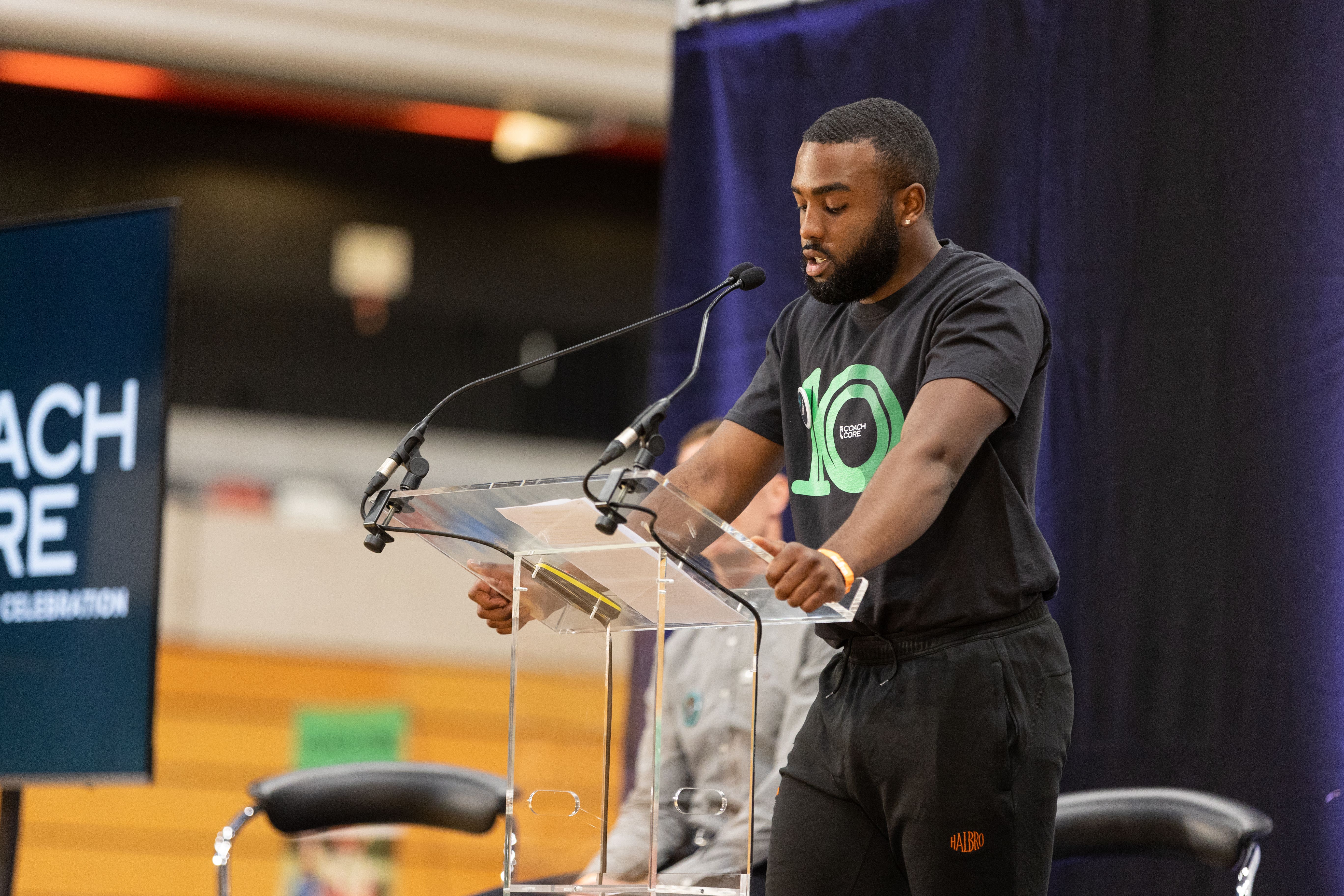 Chauncey Taylor delivers a speech at the 10th anniversary of Coach Core (Max Turner/PA)