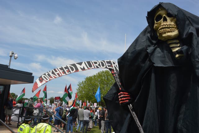 A protester near the premises of Lockheed Martin UK in Havant (Ben Mitchell/PA)