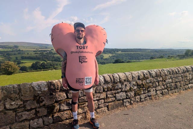 Toby Freeman in his testicles costume on Hadrian’s Wall (The Robin Cancer Trust/PA)