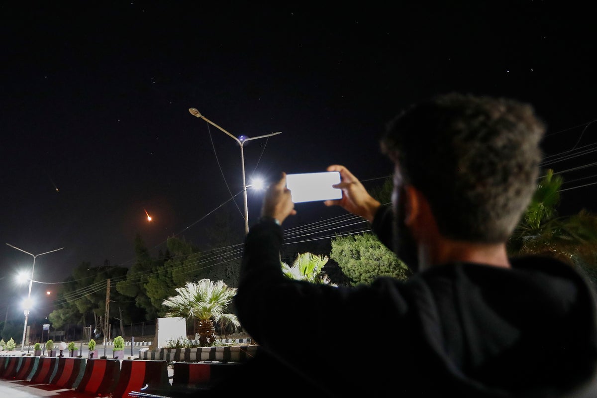 War-weary Syrians and Lebanese watch from the sidelines as missiles fly in Israel-Iran conflict