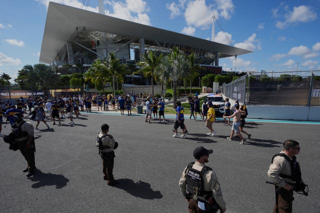 <p>Law enforcement personnel stand outside the stadium prior to the Club World Cup group C soccer match between Boca Juniors and Benfica in Miami Gardens</p>