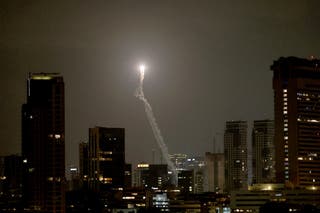 The Iron Dome, the Israeli air defense system, intercepts missiles fired from Iran, over Tel Aviv, Israel