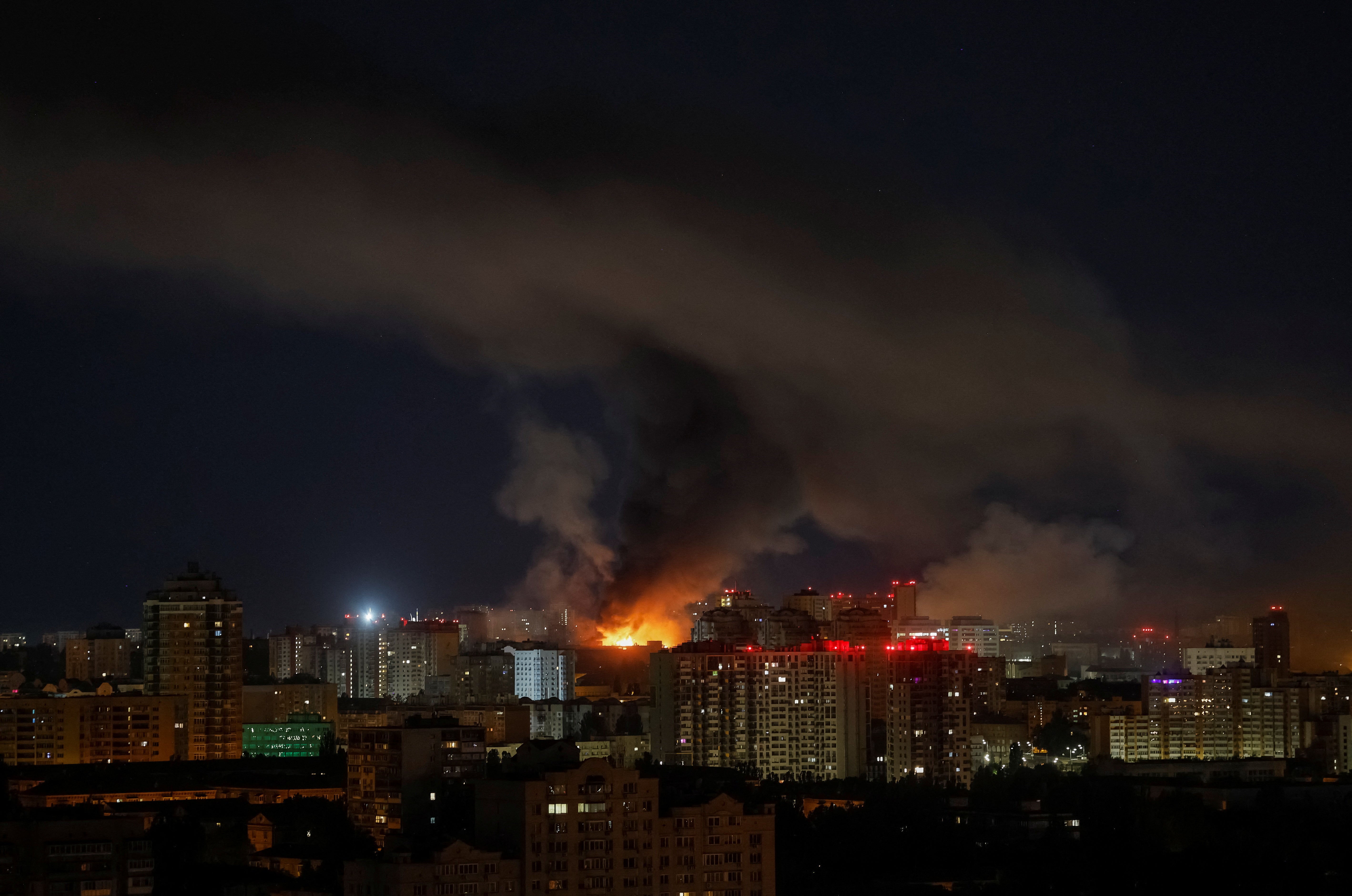 Fire and smoke rise in the city after a Russian drone strike on Kyiv