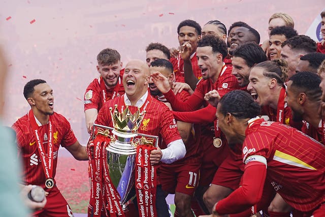 Liverpool head coach Arne Slot lifts the Premier League trophy (Peter Byrne/PA)