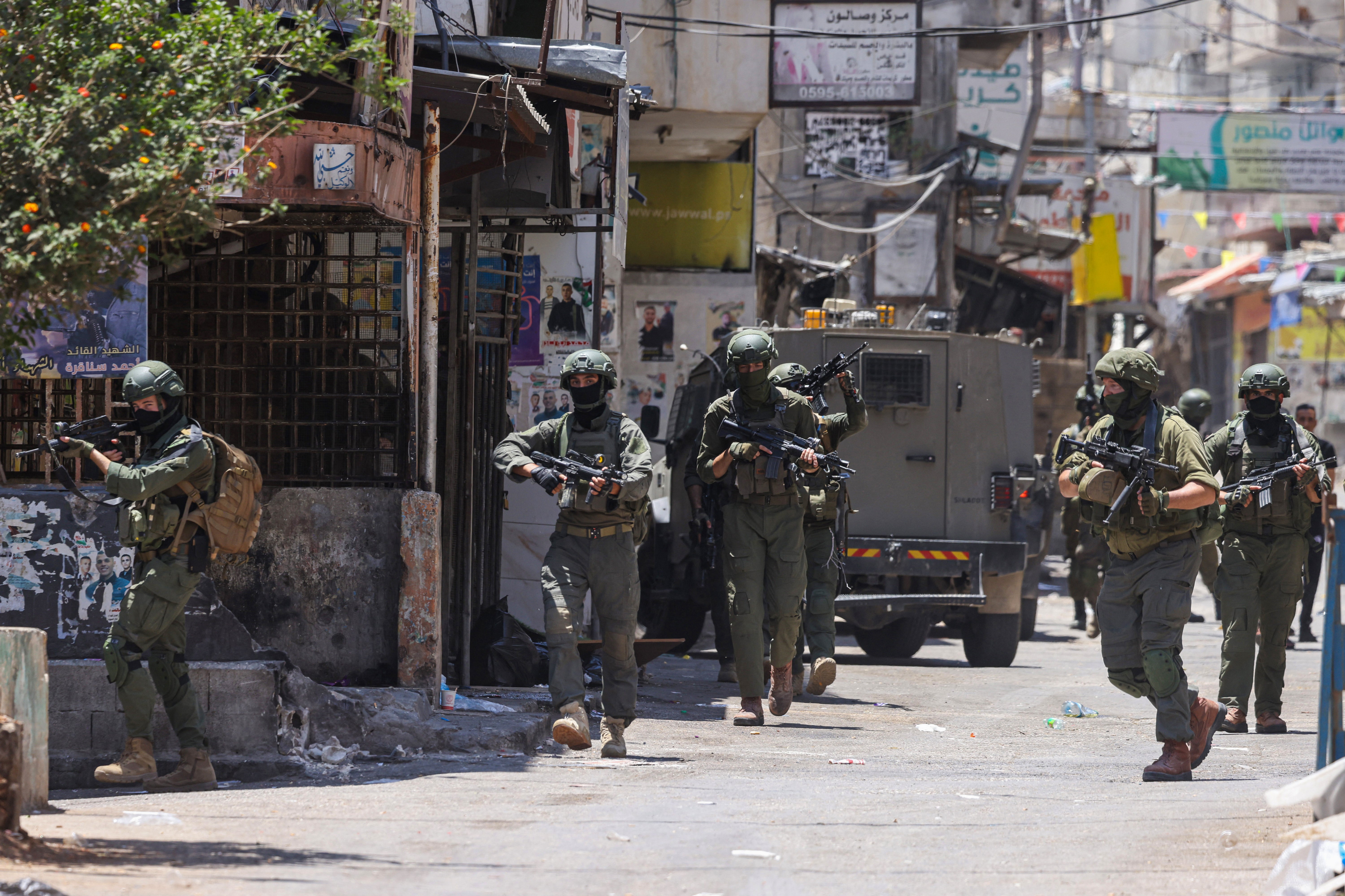 Israeli soldiers conduct a raid at the Balata refugee camp east of Nablus city in the occupied West Bank on June 18, 2025