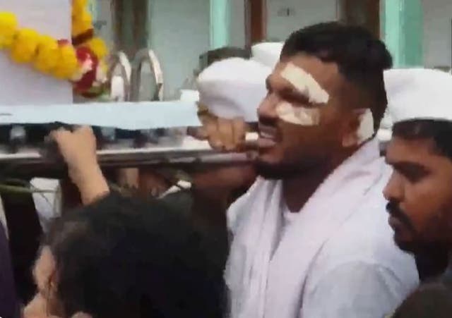 <p>Air India crash survivor seen carrying his brother's casket </p>