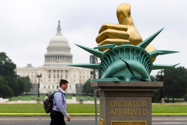 <p>A work of political art titled 'Dictator Approved' cropped up on the National Mall, days after President Donald Trump’s military parade.</p>